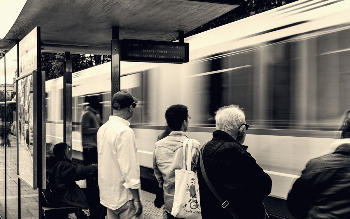 Tram passing through a central Nantes street